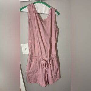 Women’s pink romper with pockets and open back size large